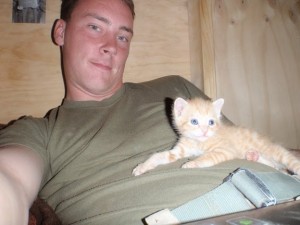 Marine with an adorable orange kitten