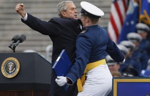 George Bush chest-bumping a young man
