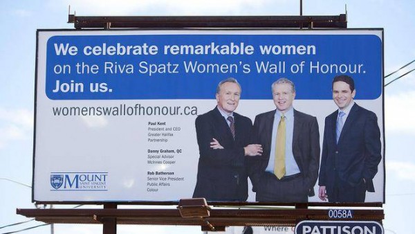 Billboard for the Riva Spatz Women's Wall of Honour featuring three white men in suits and no women