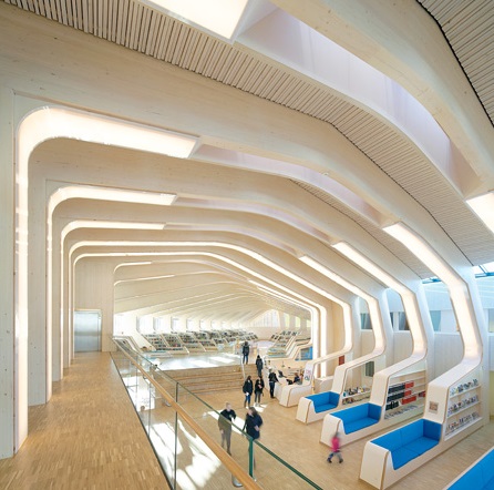 a very modern library full of light and interesting curved structural shapes