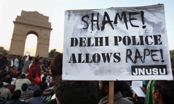 New Delhi: JNU students during a protest against the recent gang rape case, at India Gate in New Delhi on Wednesday. PTI Photo by Shahbaz Khan(PTI12_19_2012_000237B)