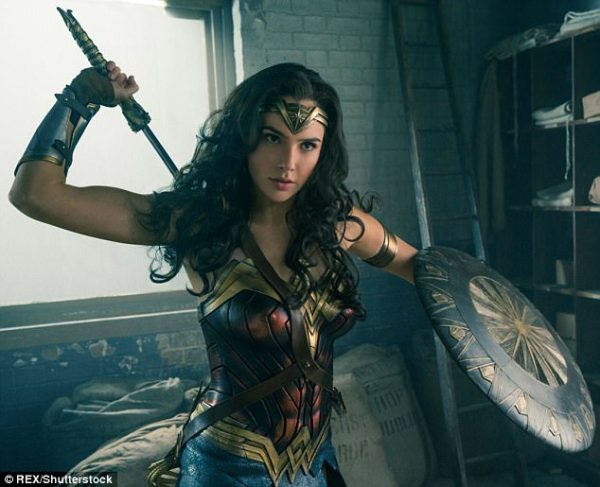 Gal Godot as Wonder Woman draws her sword