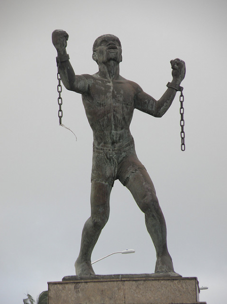 A statue of a slave breaking his chains in Barbados
